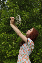 beautiful girl with a bouquet of wildflowers