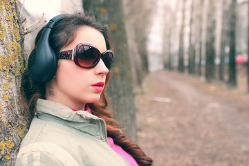 girl in park with headphone