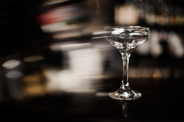 ampty cocktail glass on bar