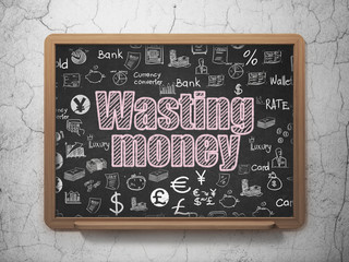 Banking concept: Wasting Money on School board background