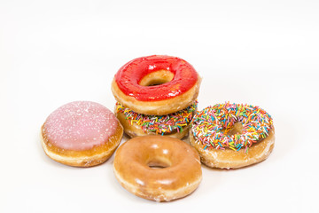 Colorful glazed donuts isolated on white background