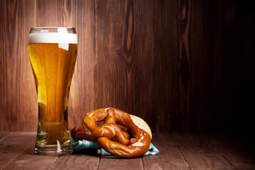 Poster Lager beer glass and pretzel © karandaev