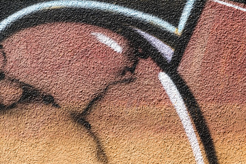 Detail of a graffiti art on a wall. Wall painted in different colors. Abstract colorful background. © msnobody