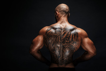 View of tattooed man's back