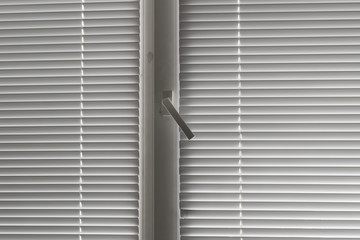 grey horizontal jalousie in the office window