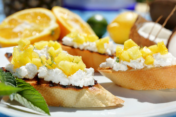 tosts with cottage cheese and pineapple on a plate