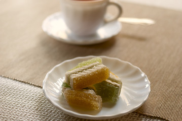 Cup with tea and sweets
