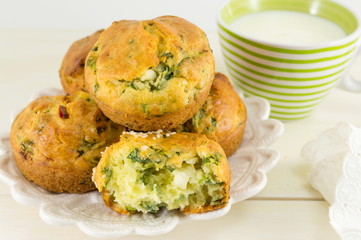 Corn bread with spinach on a wooden table
