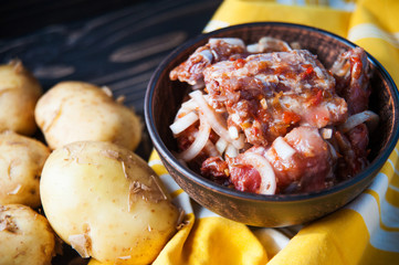 Marinated with onion pork ribs and raw potatoes