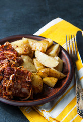 Grilled ribs with barbecue sauce, onion and hot crispy potatoes