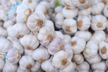 Closeup on garlic in sacks at market