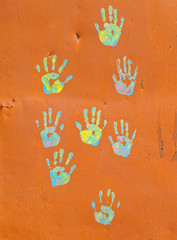 Handprints on the wall.