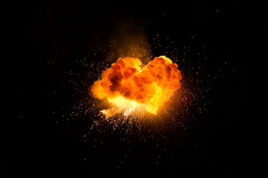 Realistic fiery explosion over a black background
