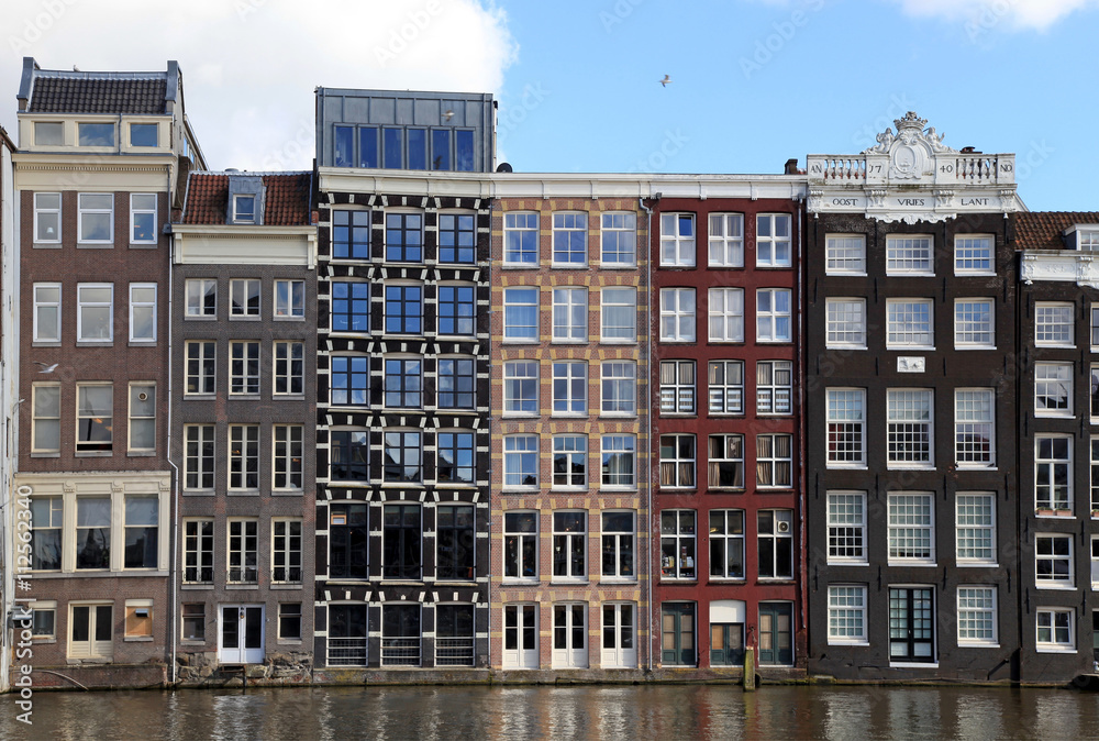 Wall mural dutch medieval buildings on canal in amsterdam