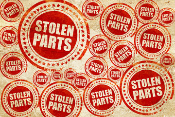 Obraz premium stolen parts, red stamp on a grunge paper texture