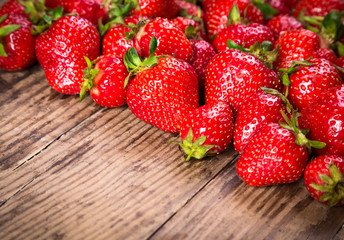 food background with strawberry on wood table