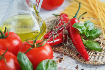 Italian food background, with  tomatoes, basil, spaghetti, olive