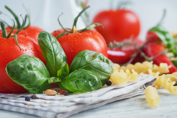 Italian food background, with tomatoes, basil, pasta, olive oil,