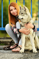 Lovely Woman Posing With a Wolf