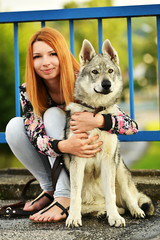 Lovely Woman Posing With a Wolf