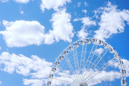 White ferris wheel against the sky