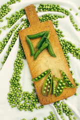 Fresh raw green beans on a chopping board