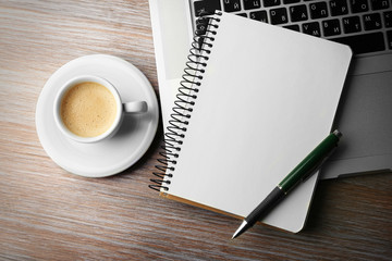 Empty  notebook on laptop keyboard, on light background