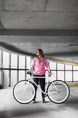 Female city resident with bicycle