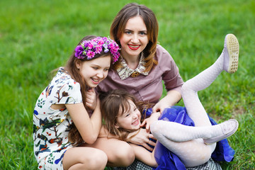 Portrait of a Young mother and her two daughters.