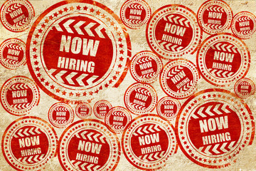 Obraz premium Now hiring sign, red stamp on a grunge paper texture