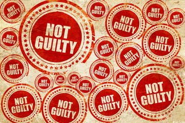 not guilty, red stamp on a grunge paper texture