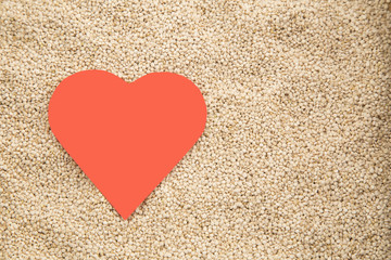 Quinoa grains on wooden background