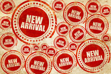 Fototapeta premium new arrival, red stamp on a grunge paper texture