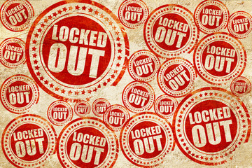 locked out, red stamp on a grunge paper texture