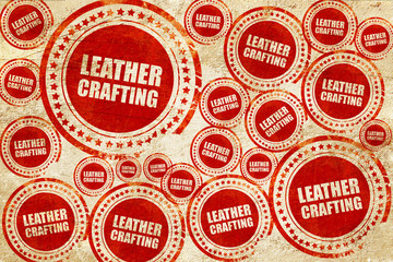 leather crafting, red stamp on a grunge paper texture