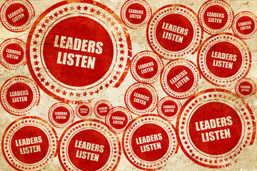 leaders listen, red stamp on a grunge paper texture