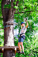 adventure climbing high wire park - people on course in mountain