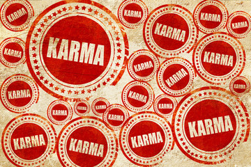 karma, red stamp on a grunge paper texture