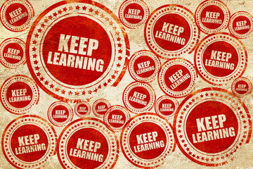keep learning, red stamp on a grunge paper texture