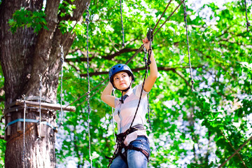 adventure climbing high wire park - people on course in mountain