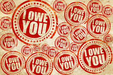 i owe you, red stamp on a grunge paper texture
