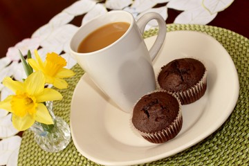 Chocolate muffins and a cup of coffee
