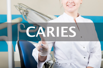 technology, internet and networking in medicine concept - medical doctor presses caries button on...