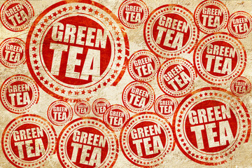 green tea, red stamp on a grunge paper texture