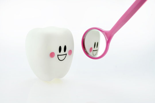 smiling teeth toy emotion with dental mirror