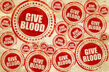 give blood, red stamp on a grunge paper texture