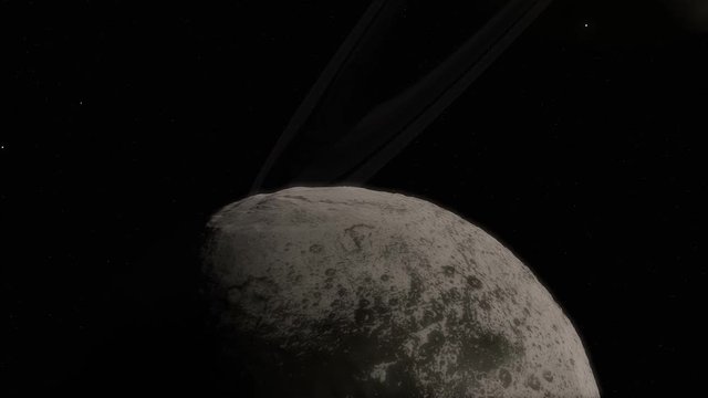 A close-up timelapse animation of Iapetus moon with a gigantic perspective of Saturn transit

