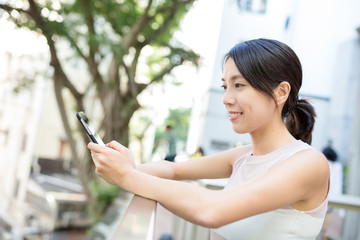 Woman sending sms on phone