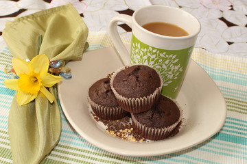Chocolate muffins and a cup of coffee