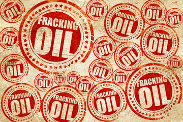 fracking oil, red stamp on a grunge paper texture